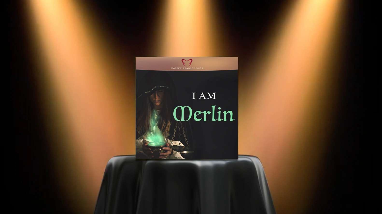 spotlight graphic: bar table with black cloth highlighted by three spotlights, with "i am merlin" product cover presented on top of table